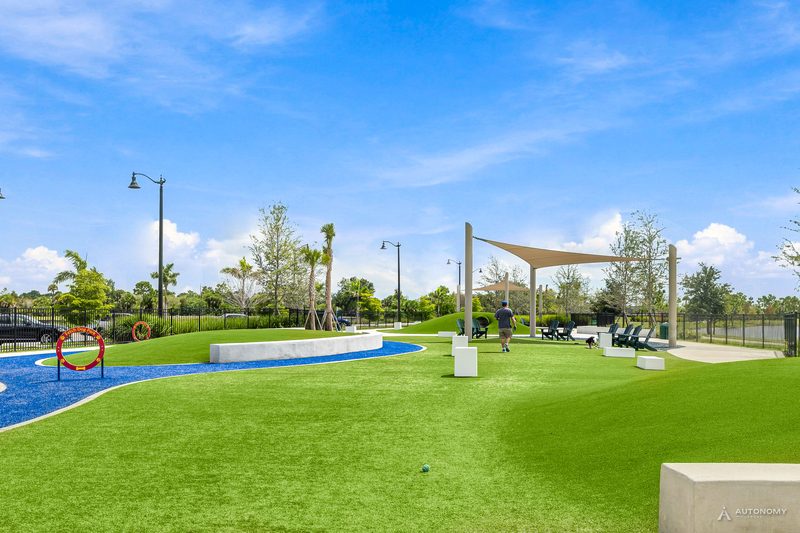 Fetch Dog Park on the Downtown Wellen waterfront in Wellen Park, with turf, paths, shade sails and agility features